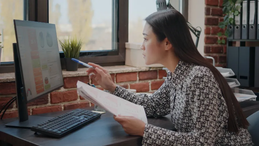 asian-woman-comparing-charts-papers-computer-working-plan-business-project-startup-office-company-employee-analyzing-documents-design-financial-data-strategy (1)