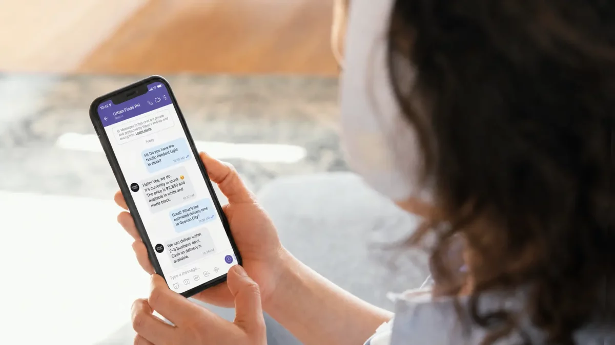 close up woman holding smartphone viber